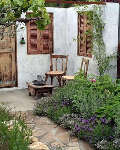 wooden table and chairs in a classic garden